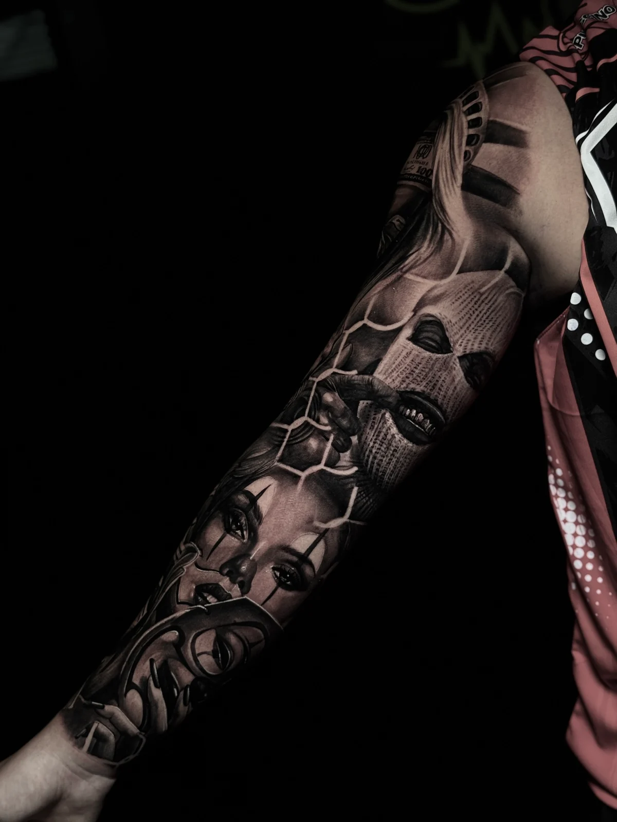 Chicano arm sleeve with Statue of Liberty, balaclava, payasa, and smile-now mask at Bloodline Tattoo Phuket.