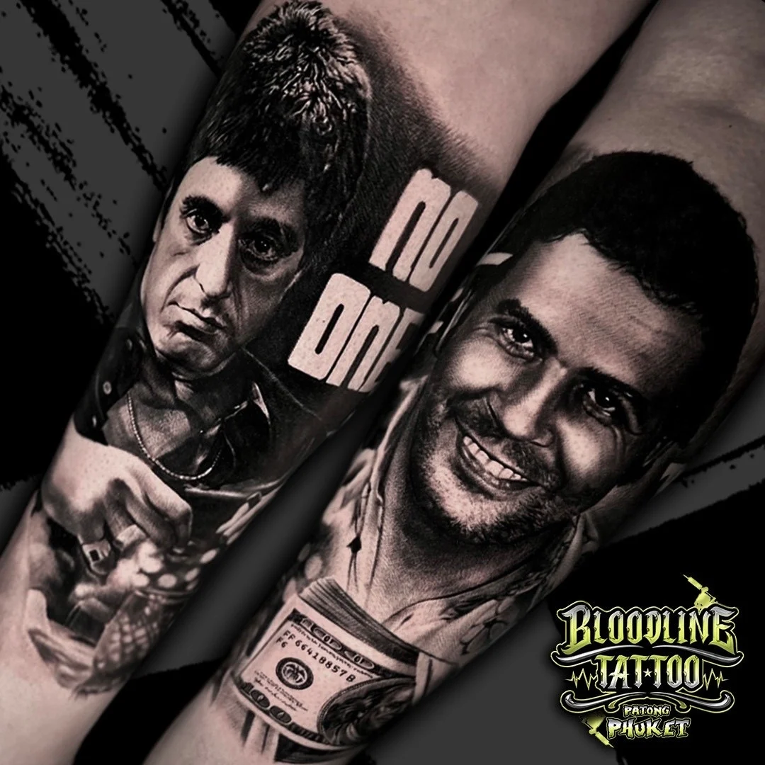 Black and grey portrait realism dual tattoo of Tony Montana from Scarface and Pablo Escobar with NO ONE lettering at Bloodline Tattoo Phuket.